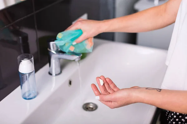 Woman washing up in the morning — Stock Photo, Image