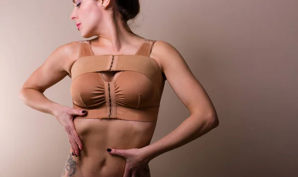Woman wearing a compressing bra — Stock Photo, Image