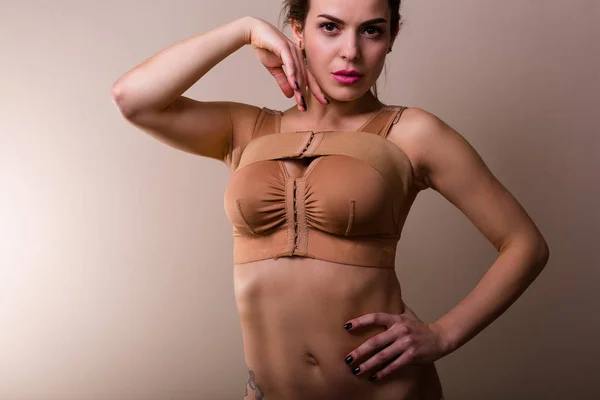 Woman wearing a compressing bra — Stock Photo, Image