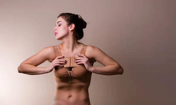 Woman wearing a compressing bra — Stock Photo, Image