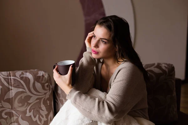 Woman enjoying a cup of coffee