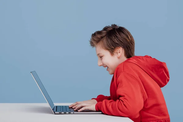 Side view happy excited boy playing on laptop — Stok fotoğraf