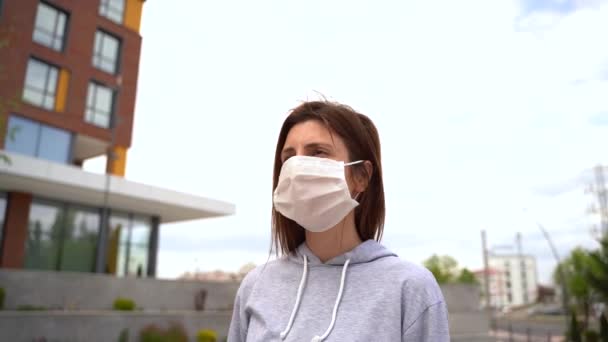 Health, safety and pandemic concept - young woman wearing protective — Stock Video