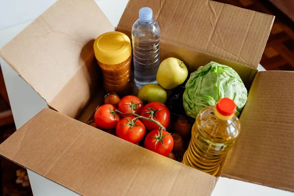 Close-up cardboard box with different fresh packed food products. — Stock Photo, Image
