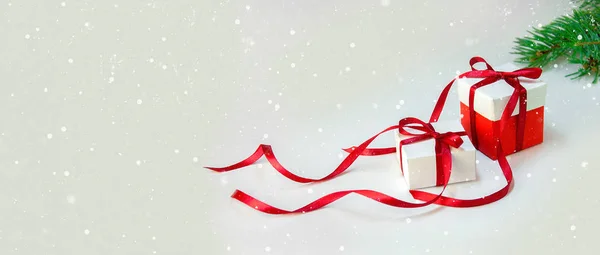 Christmas Gift's in White Box with Red Ribbon on Light Background. New Year Holiday Composition Banner. Copy Space — Stock Photo, Image