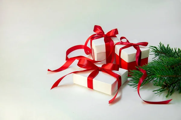 Christmas Gift's in White Box with Red Ribbon on Light Background. New Year Holiday Composition. Copy Space — Stock Photo, Image