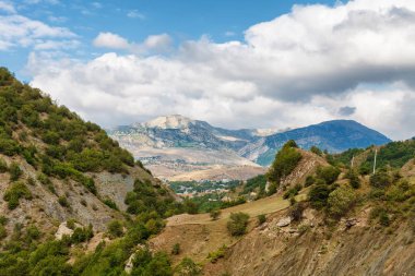 View of mountains Babadag and a muddy road along the river Girdimanchay Lahij yolu from the side in Lahic village, Azerbaijan clipart