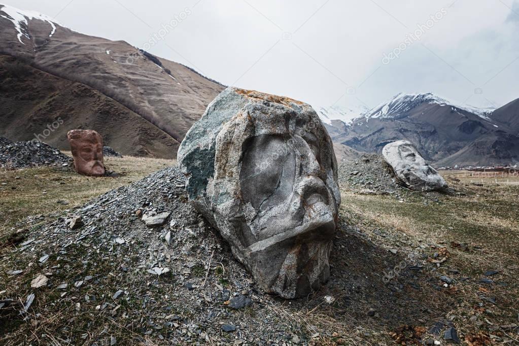 Stone face head in Sno valley in Georgia along the military road to Kazbegi