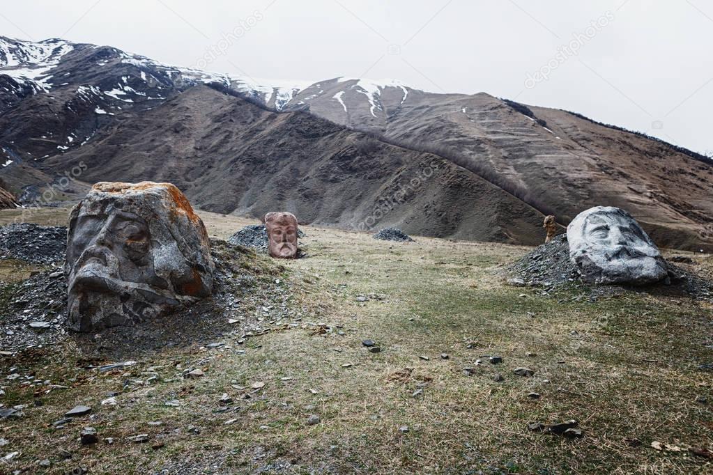Stone face head in Sno valley in Georgia along the military road to Kazbegi