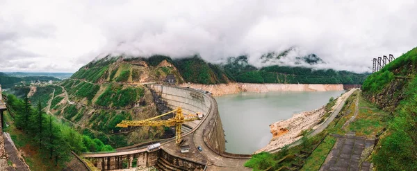 Panoramic view of The Enguri hydroelectric power station HES. The Jvari Reservoir next to Inguri Dam, surrounded by mountains, Upper Svaneti, Georgia. Second highest concrete arch dam in the world