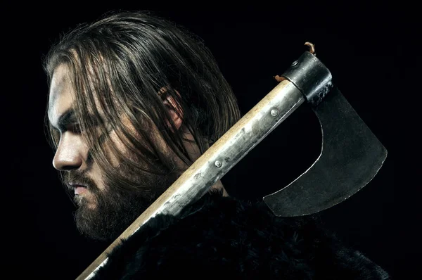 Formidable viking in armor and axe on black background — Stock Photo, Image