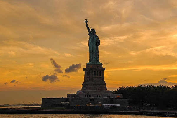USA, New York State, New York City, Statue of Liberty at sunset