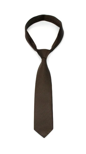 Стильный связанный коричневый галстук на белом фоне — стоковое фото