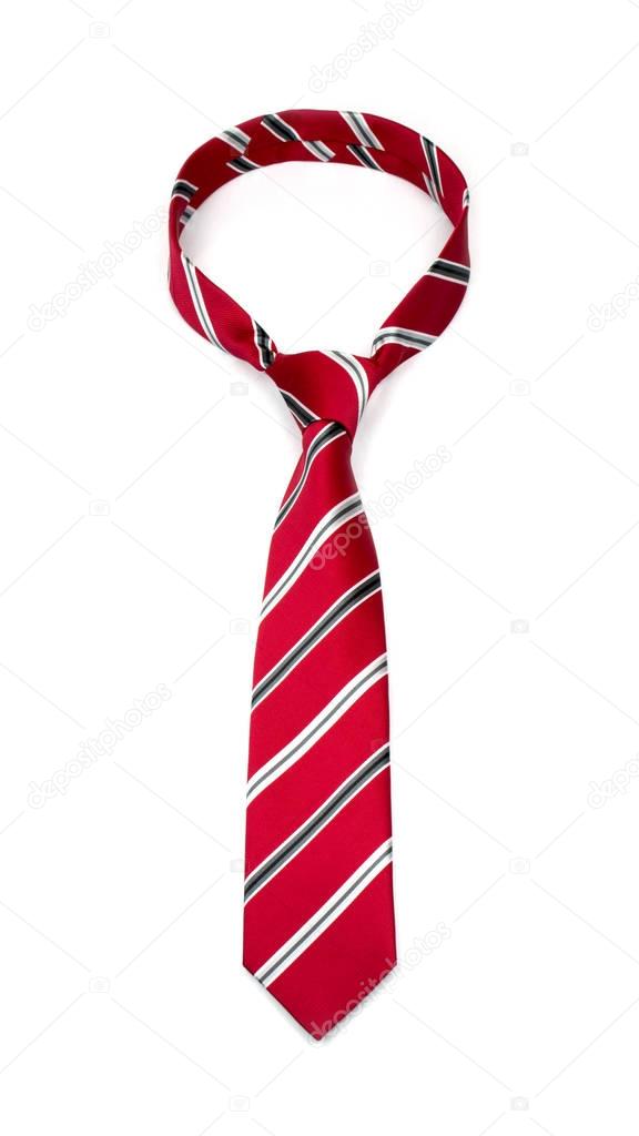 stylish tied bright red striped tie with black and white lines isolated on white background