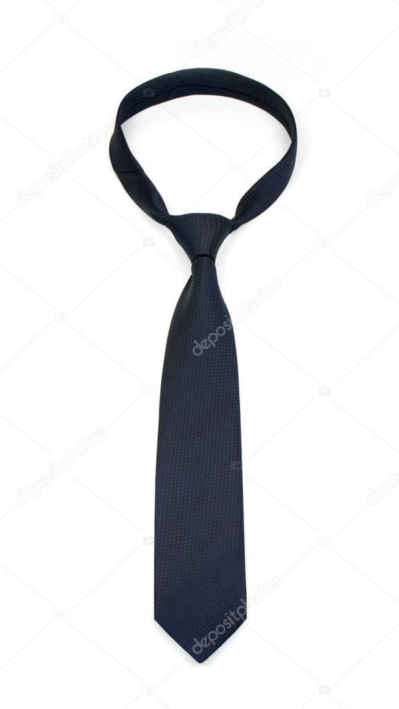 stylish tied dark blue tie isolated on white background