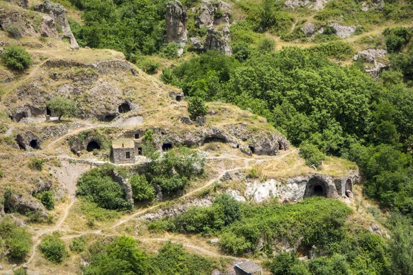 Caves in beautiful canyon at Khndzoresk cave settlement (13th-century, used to be inhabited till the 1950s), Syunik region, Armenia — Stock Photo, Image