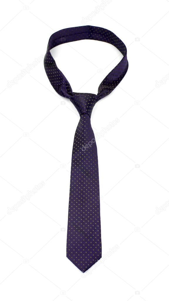 stylish tied dark purple tie with dots isolated on white background