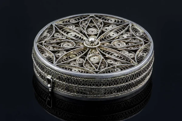 Elegant antique small silver casket for jewelry isolated on black background with reflection. Work of an unknown jeweler 18th century, Armenia — Stock Photo, Image