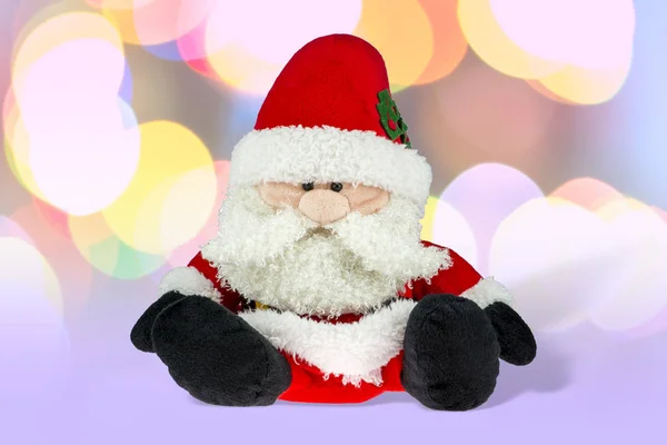 Little Santa Claus Plush Toy Isolated Blurred Colorful Lights Background — Stock Photo, Image