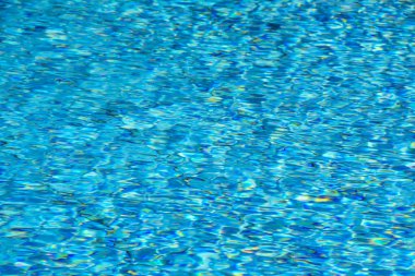 Bir Yüzme Havuzu--mavi köpüklü ve güneş ışığı yansıtan yüzey. Mavi su seamless modeli