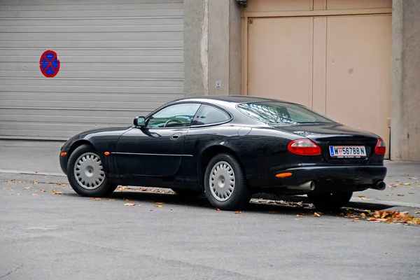 stock image Vienna, Austria - October 30, 2007: dark blue 2006 Jaguar XK-Series Coupe sports car is parked on the street