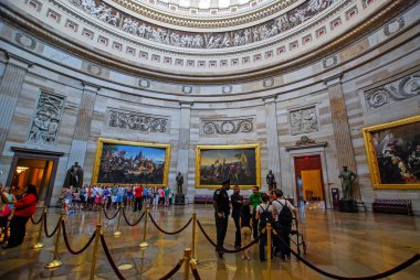 Washington, DC, USA - August 04, 2012: interior of the Washington capitol hill dome Rotunda with tourists clipart
