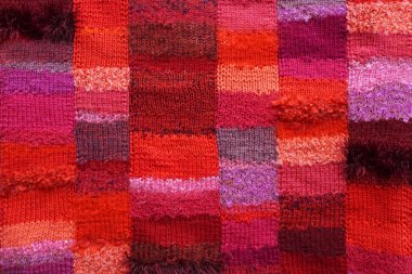 Renkli örgü doku. Yünden kumaş. Arka plan kopya alanı. El yapımı kazak doku, örme yün desen, multicolour arka plan