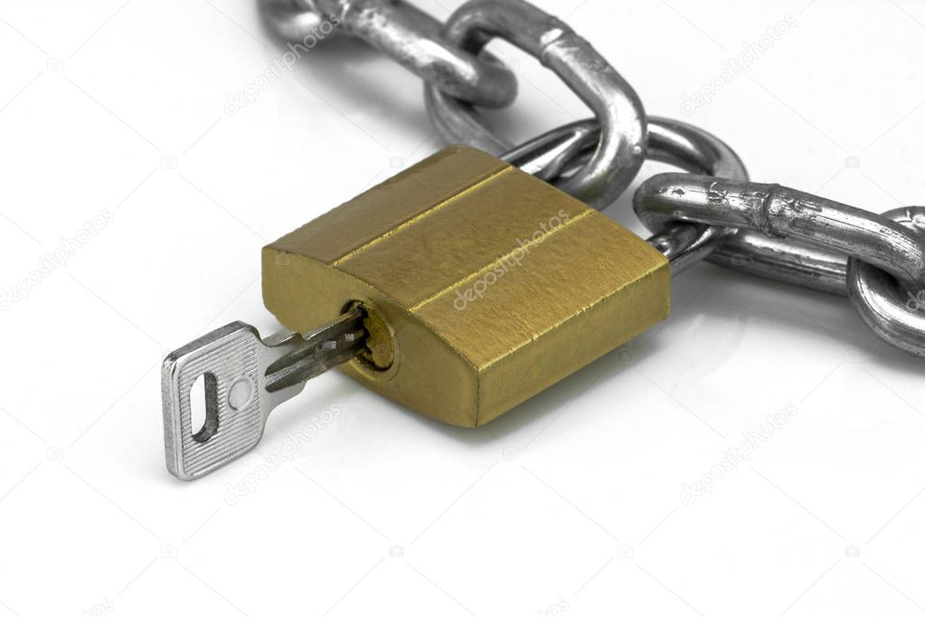 Metal chain, brass locked padlock showing keyhole and a key, isolated on white background