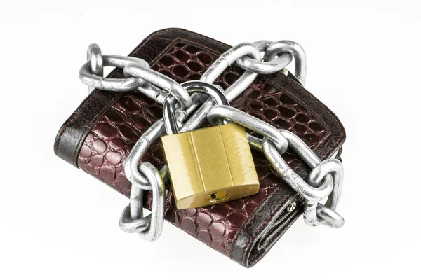 Leather wallet with brass lock and metal chain isolated on white  background. Concept of protecting electronic money and safety personal finances. Financial security in cashless and cash settlements