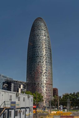 Barcelona, Spain - July 31, 2019: The Torre Glories building formerly known as Agbar Tower against the blue sky. This 38-storey tower was designed by famous Jean Nouvel