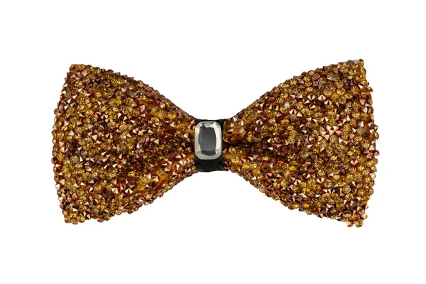 Glamorous gold sparkling glitter decorated bow tie with jewel in the centre, trendy fashion accessory isolated on white background