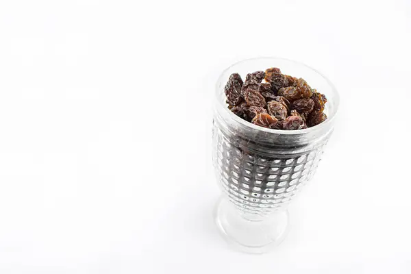 stock image Cup with raisins.