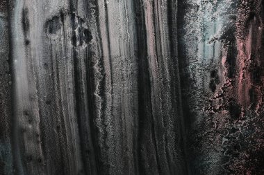 Camdaki akrilik boyalarla çizilmiş soyut arkaplan