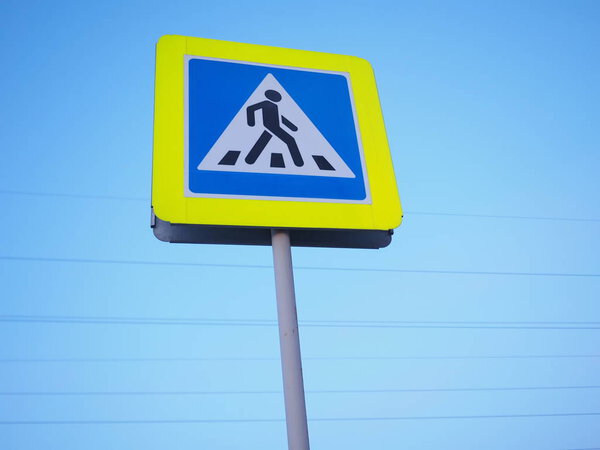 road sign-pedestrian crossing against the sky