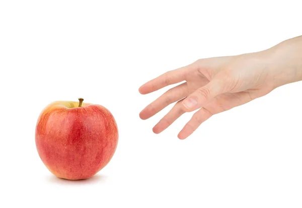 A female hand takes a red apple isolated on a white background. — Stock Photo, Image