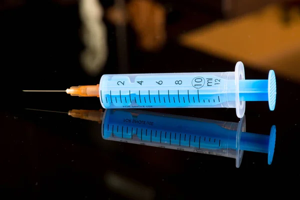 Drug syringe on black background — Stock Photo, Image