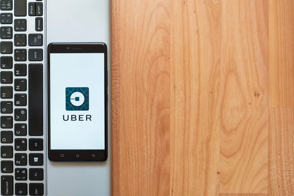 Uber logo on smartphone — Stock Photo, Image