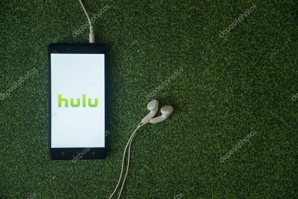 Los Angeles, USA, october 23, 2017: Hulu logo on smartphone screen on green grass background.