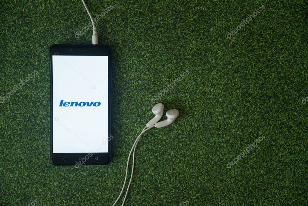 Los Angeles, USA, october 23, 2017: Lenovo logo on smartphone screen on green grass background.