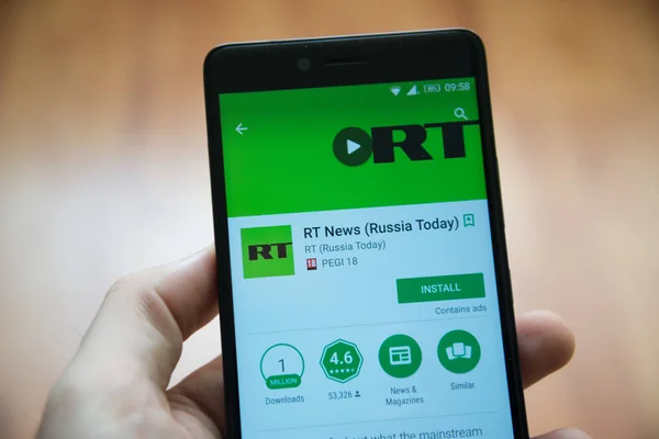 Adam el smartphone Rt haberleri - Rusya bugün uygulama google oyun mağaza ile tutarak — Stok fotoğraf