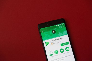 Los Angeles, 11 Aralık 2017: Smartphone Google ile oynamak oyun uygulama google oyun deposunda bulunan kırmızı arka plan