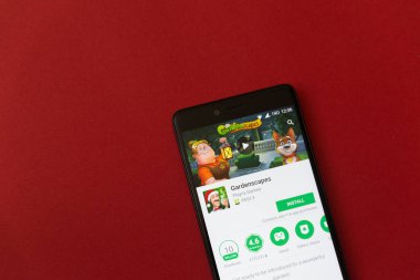 Los Angeles, 11 Aralık 2017: Smartphone Gardenscapes oyun uygulama Google ile oynamak mağaza kırmızı zemin üzerine