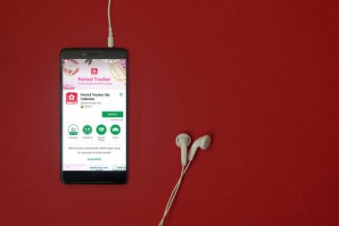 Los Angeles, 11 Ocak 2018: Smartphone ile google oyun izci uygulamada takılı kulaklık ile kırmızı zemin üzerine depolamak ve uzay kopyalamak dönem