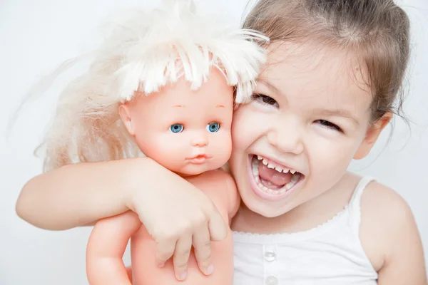 Little girl with a doll — Stock Photo, Image