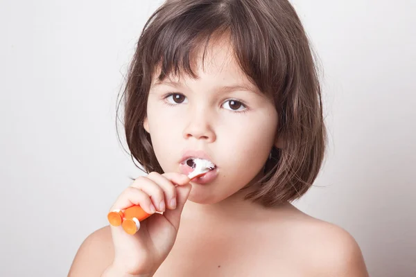 Girl cleans teeth Royalty Free Stock Photos