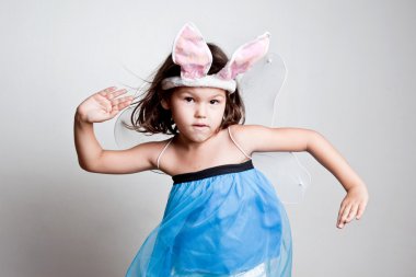 Girl dresses up in bunny ears clipart