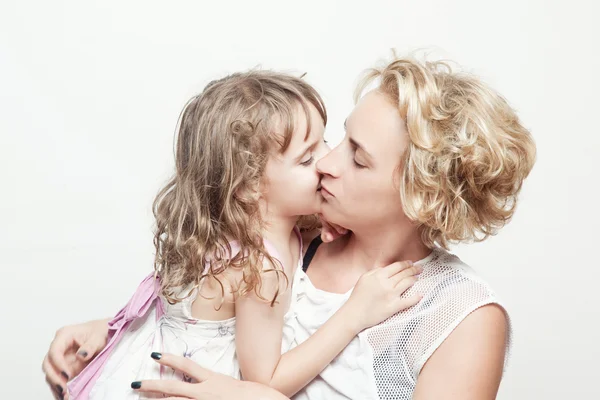 Mother and daughter kissing — Stock Photo, Image