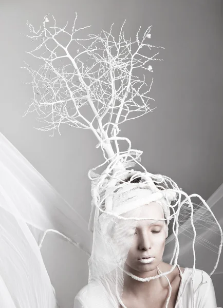 Girl with decorative tree on her head — Stock Photo, Image