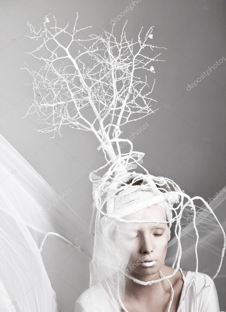 Girl with decorative tree on her head