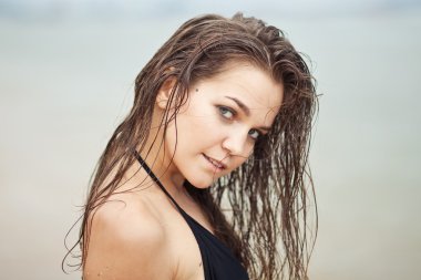 woman portrait with wet hair on the beach  clipart